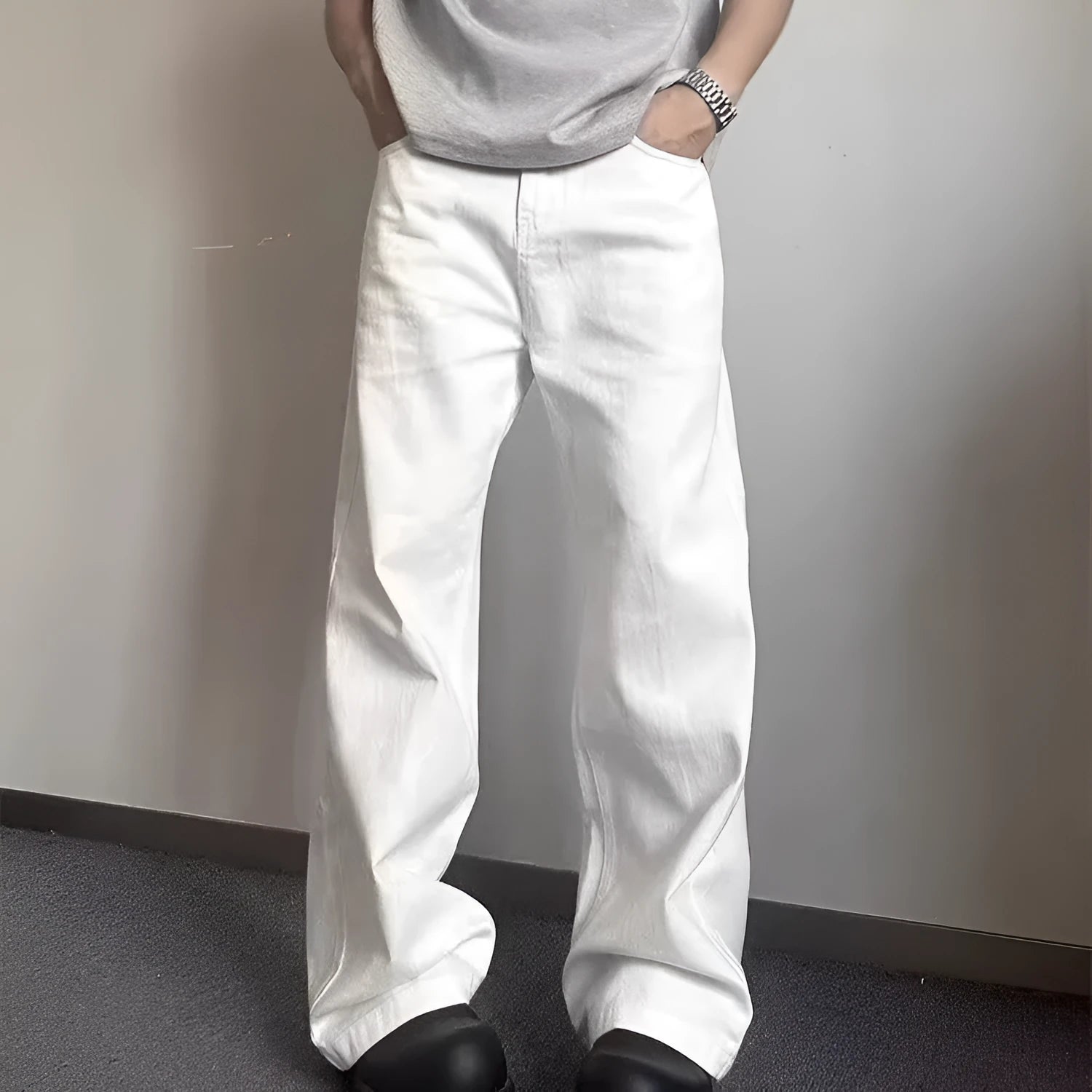 Men's white straight leg jeans with mid-waist zipper fly and loose wide leg cotton denim design