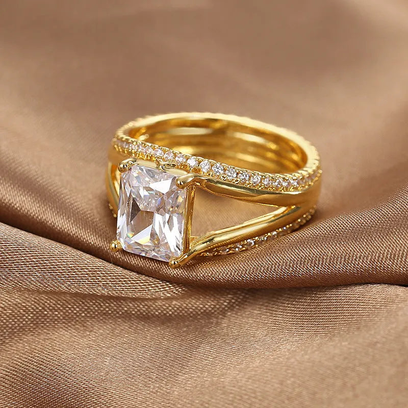 Geometric gold electroplated ring with square zircon stone showing European styling