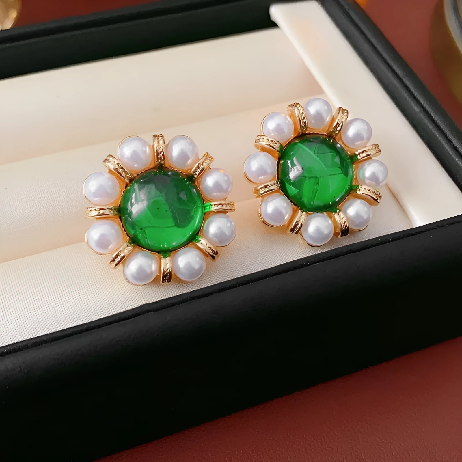 Gold electroplated pearl stud earrings with geometric shape and round elements