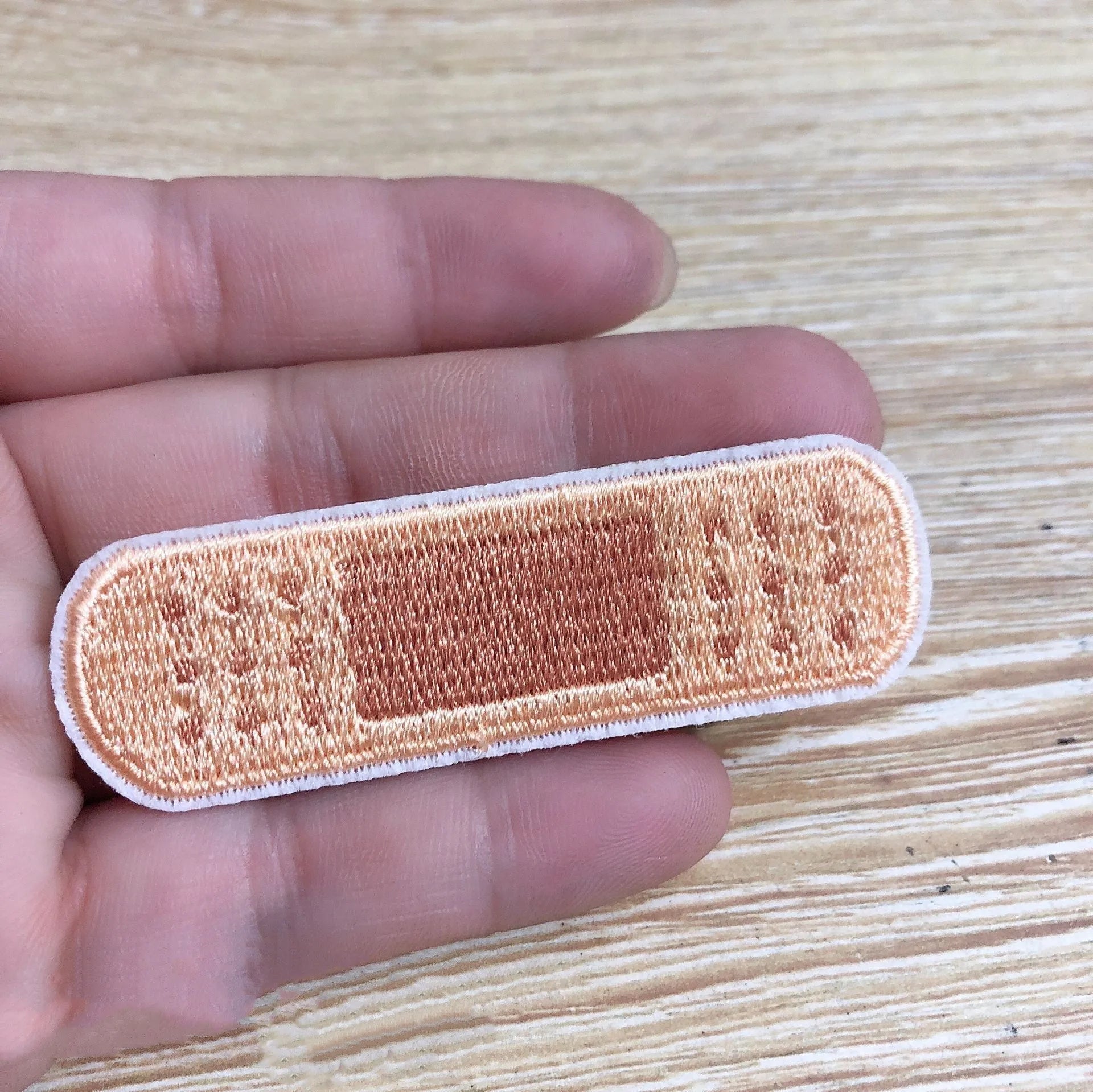 Pack of ten embroidered iron-on cloth patch badges for clothing and craft customisation.