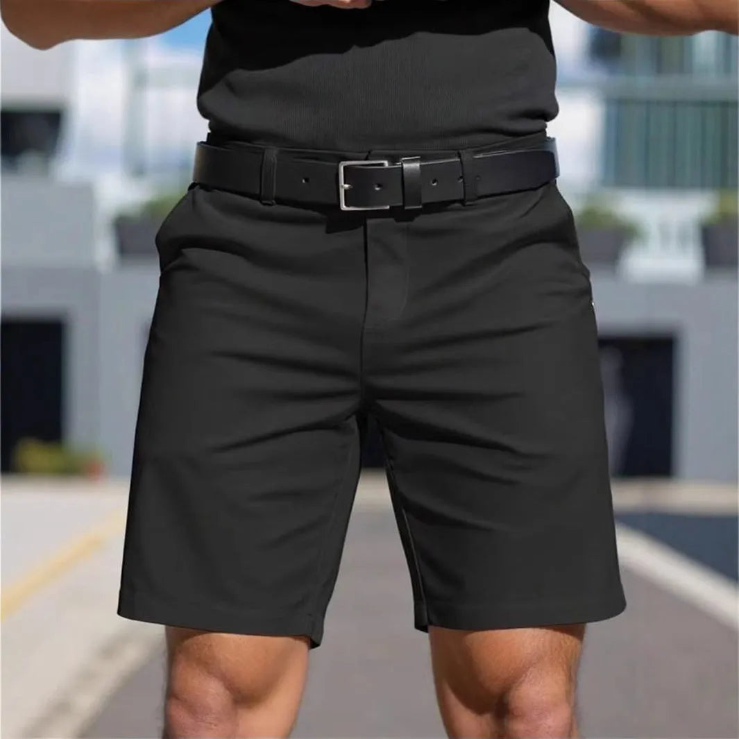 Man wearing straight-leg micro-elastic polyester fifth pants shorts in a choice of nine colours.