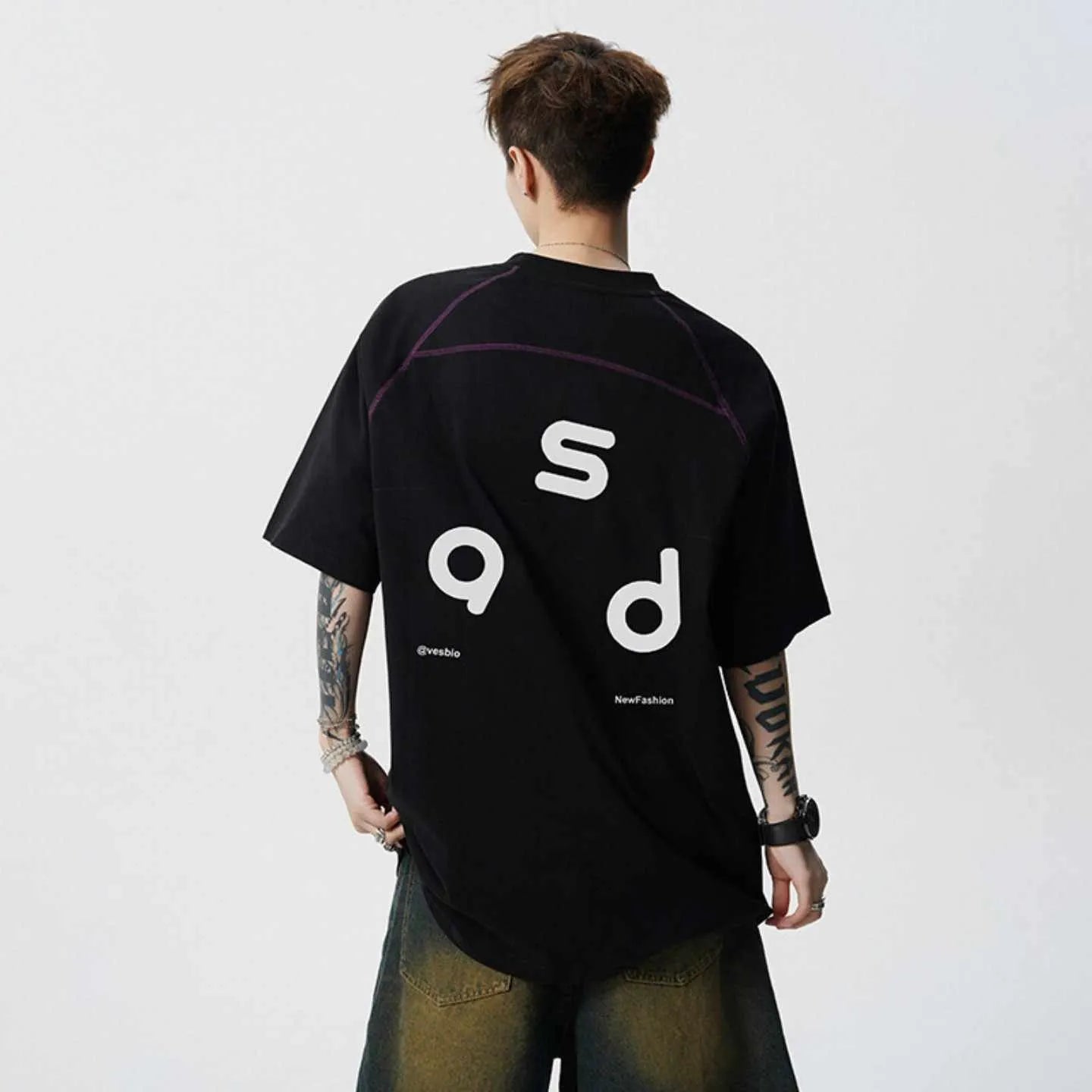 Men's loose fit black cotton t-shirt with a letter print on the front, short sleeves, and a round neck.