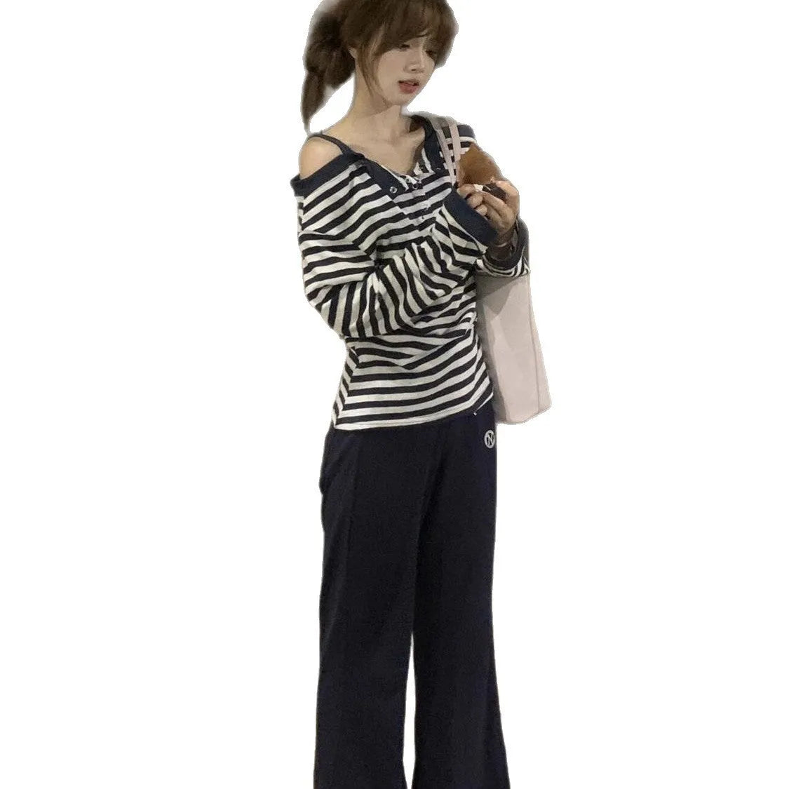 Dark blue women's oversized long-sleeved t-shirt with stripe, button, and embroidery details on viscose fabric.