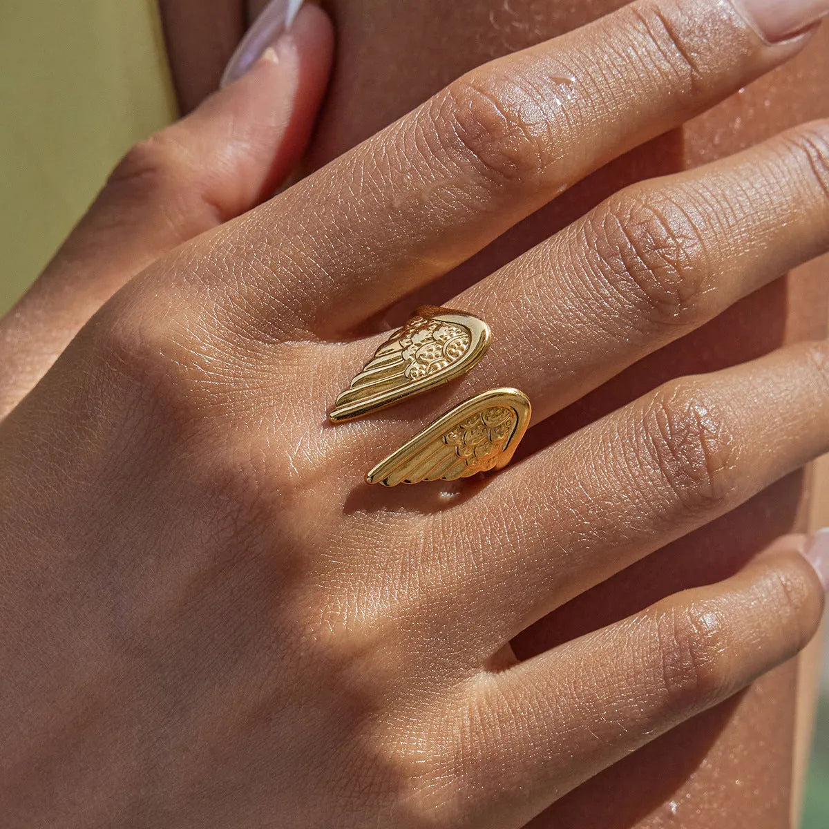Stainless steel adjustable wings ring in an electroplated silver colour finish.