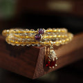 Natural Brazilian gold rutilated quartz bracelet with Chinese three-ring design and chopstick hanging elements