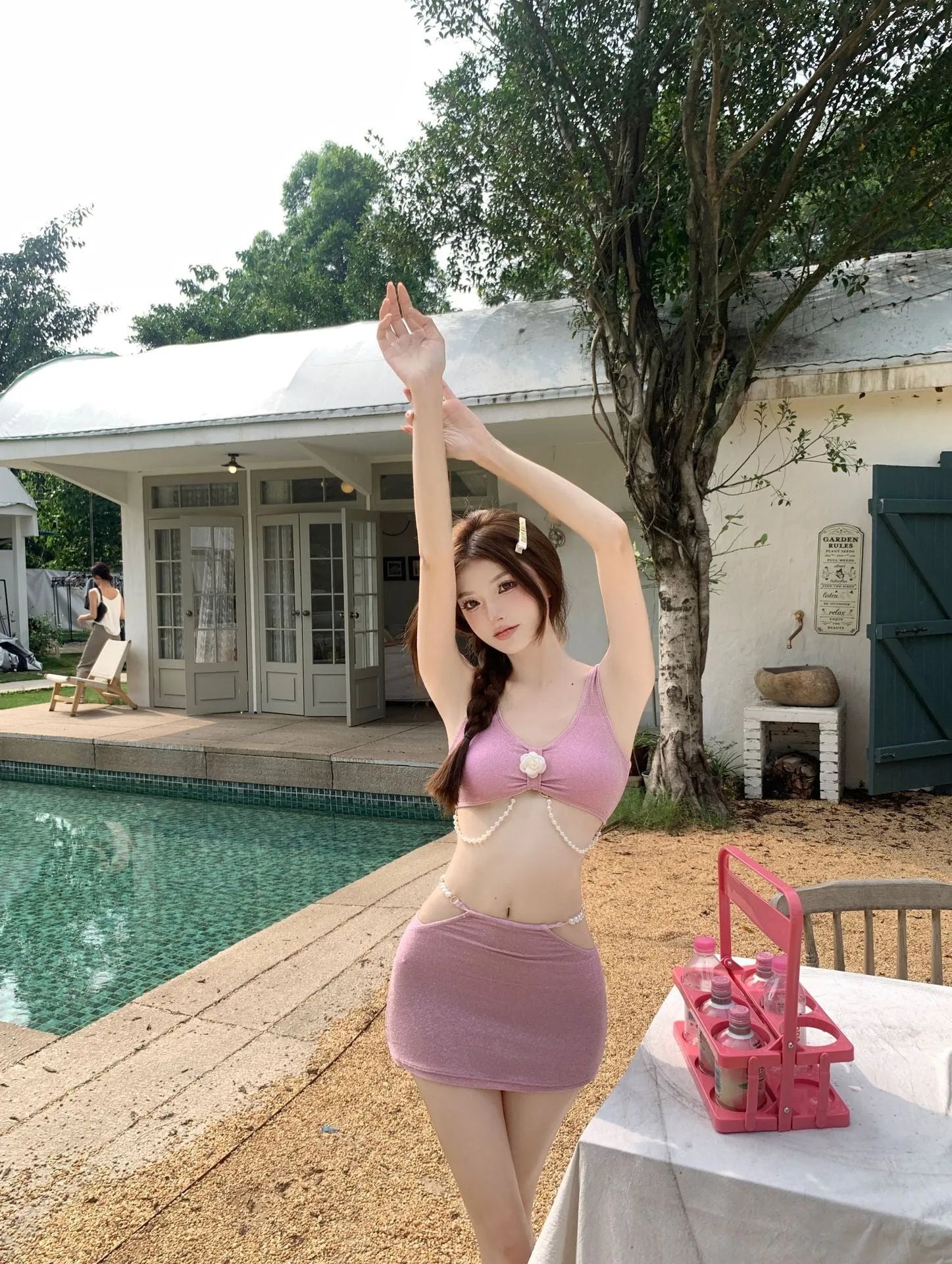 Bear Vacation pink and black three-piece polyester bikini set for swimming.