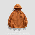 Lightweight Lycra hooded sun protection jacket in gray on a person standing outdoors