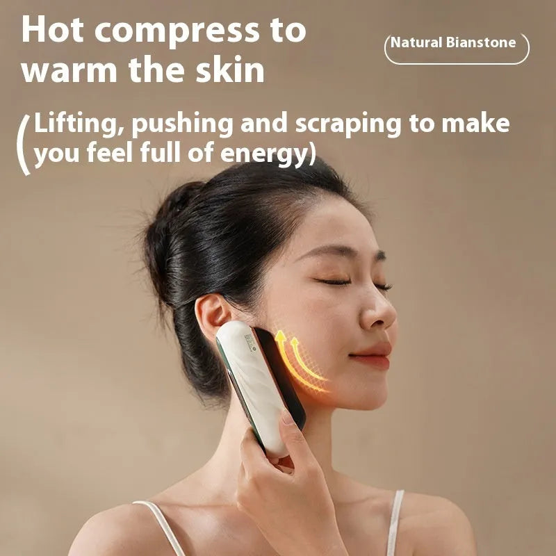 Gold coloured electric Gua Sha facial massage tool with a smooth metal scraping plate.