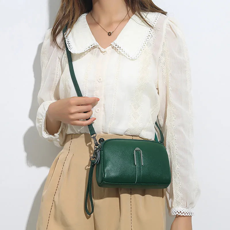 Women's genuine leather square shoulder bag in dark khaki colour, showing its structured shape and shoulder strap.