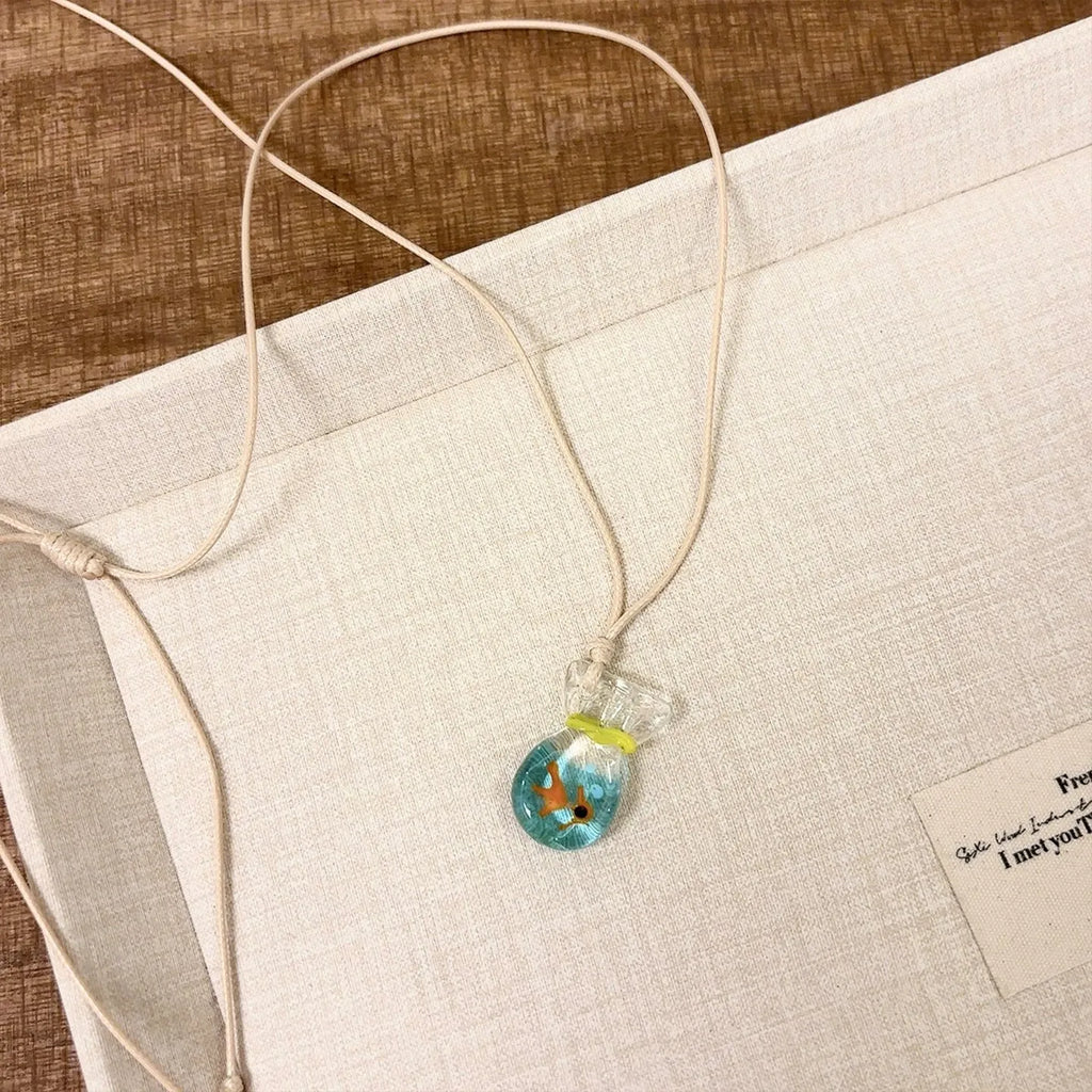 Women's coloured glaze pendant necklace with cotton linen chain featuring Skirt Everyday Joker design