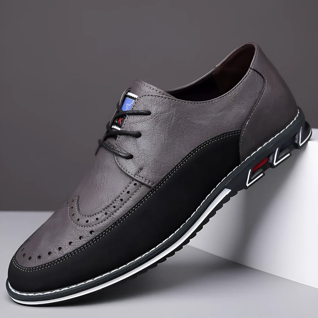 Men's black leather toe cap casual shoes with a fabric upper and rubber sole on a white background.