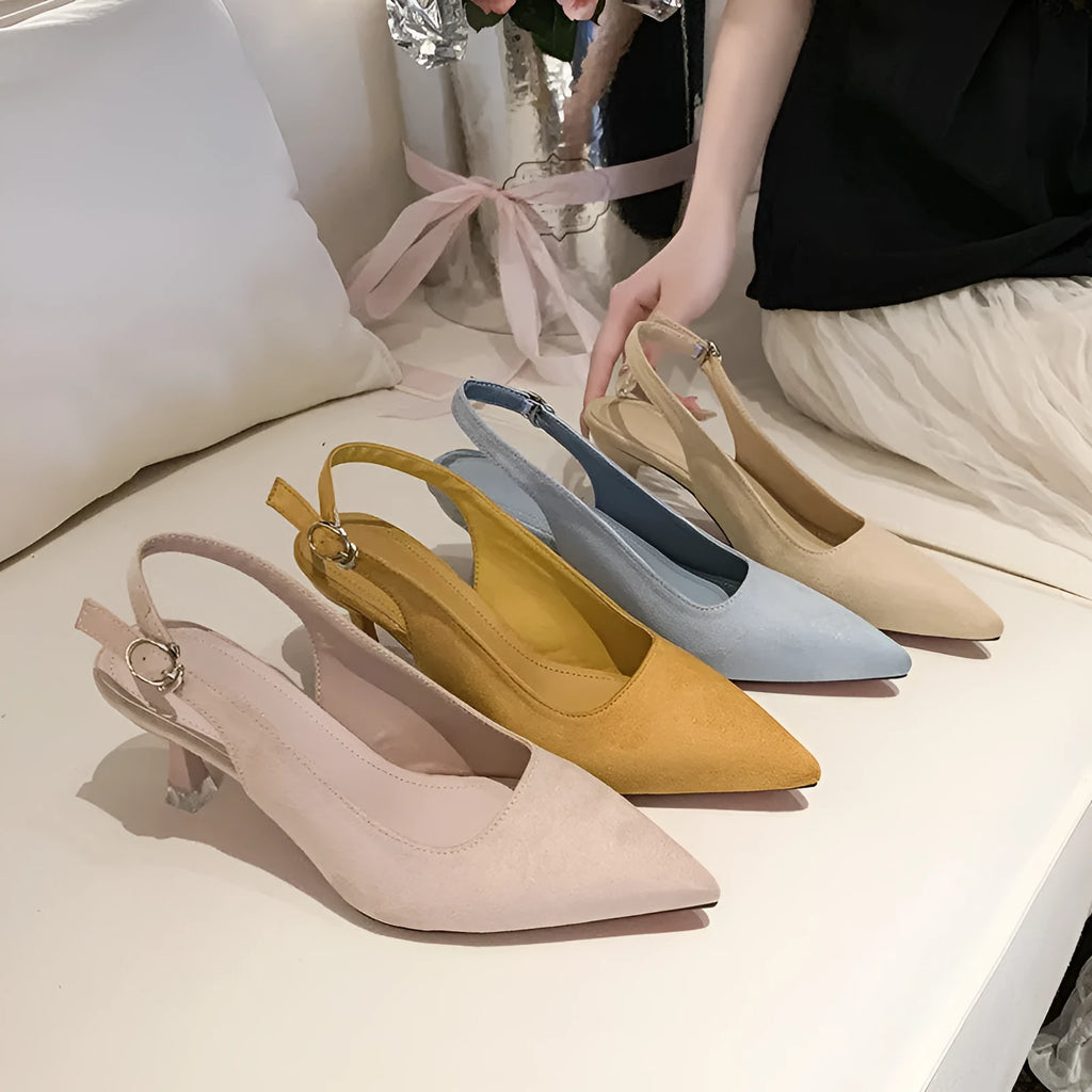 Pointed toe stiletto high heel shoe in suede with a rubber sole.