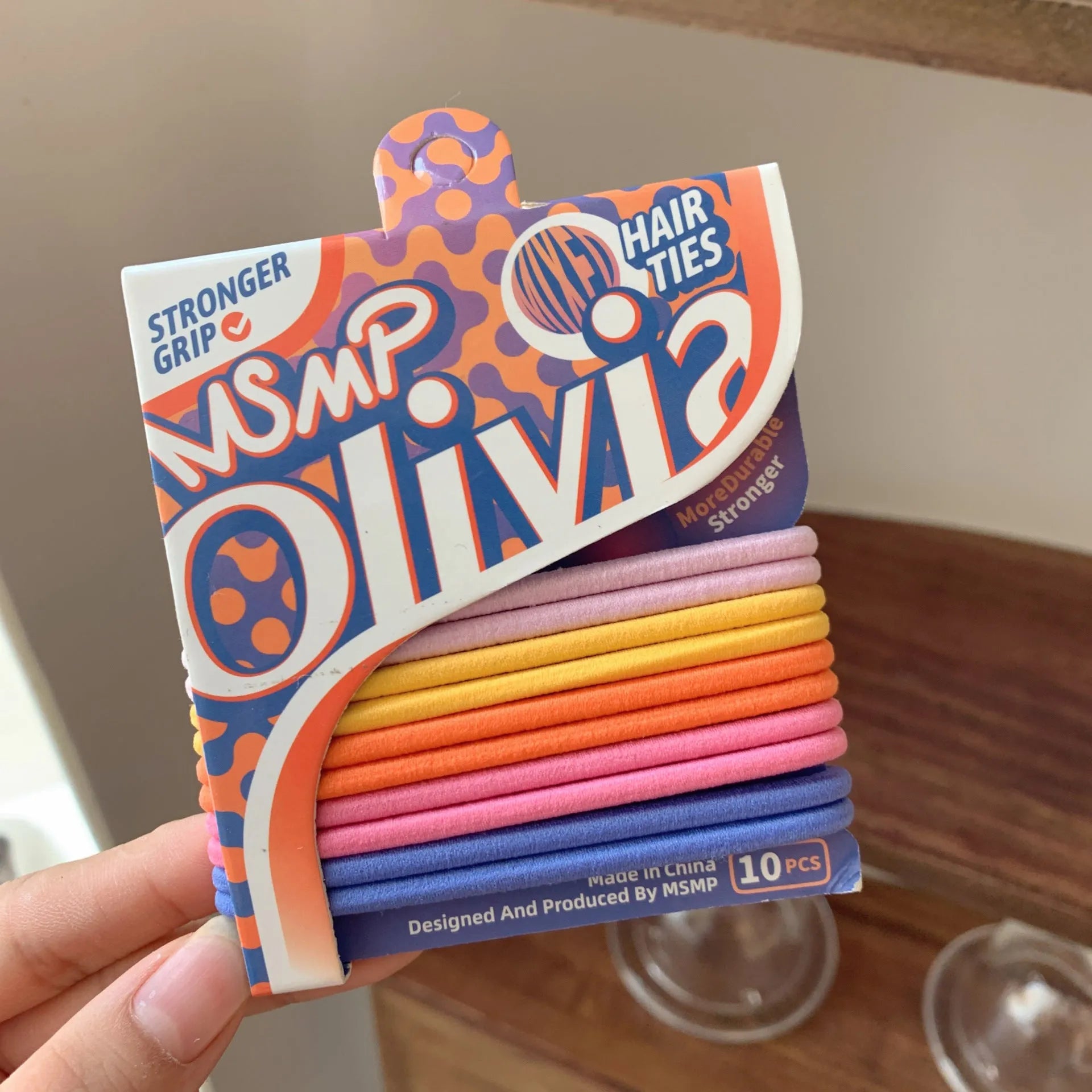 Assorted candy colour braided elastic hair bands for men and women on a white background.