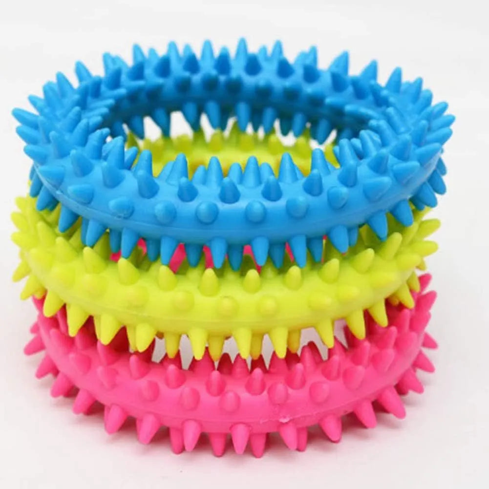 TPR spiky circle ring dog chew toy in assorted colours showing dental cleaning nubs