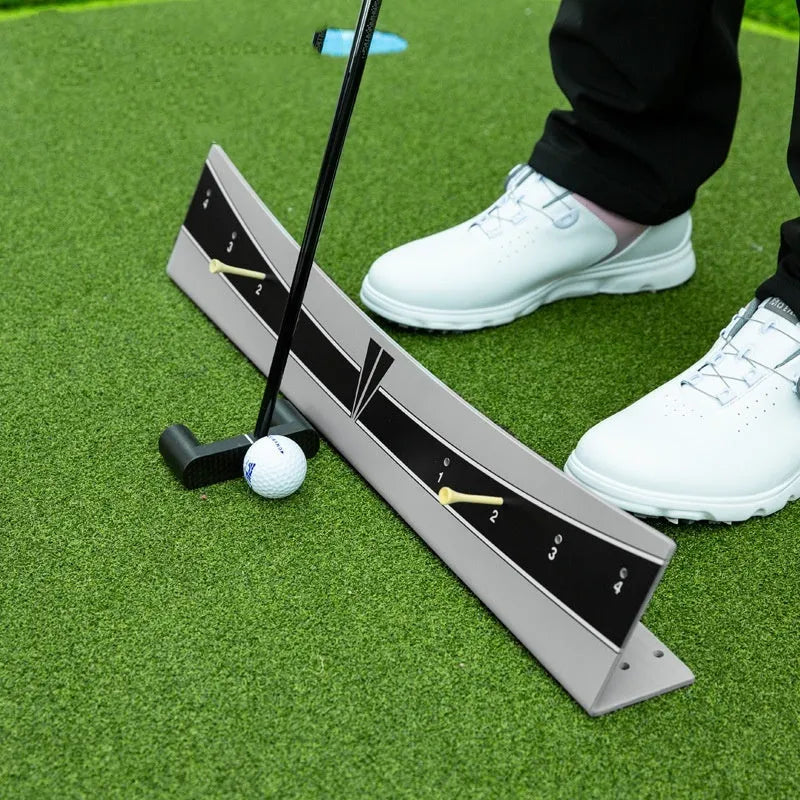 Adjustable golf putter balance simulator with PVC construction on a flat surface.