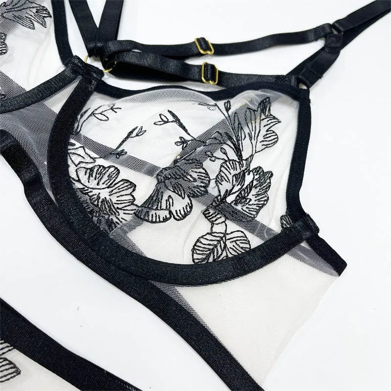 Black lace mesh three-piece set with floral print showing V-neck top, high-waisted pants, and waist ring