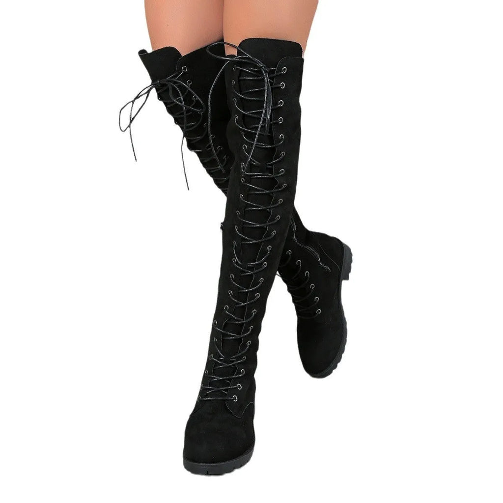Black lace-up over-the-knee boots with a flat heel and round toe on a white background.