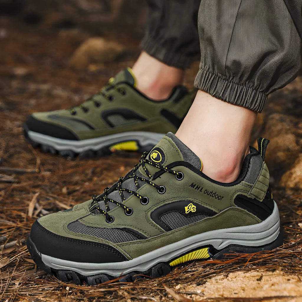 Men's waterproof non-slip mountain climbing sneakers soft bottom in army green on rocky trail