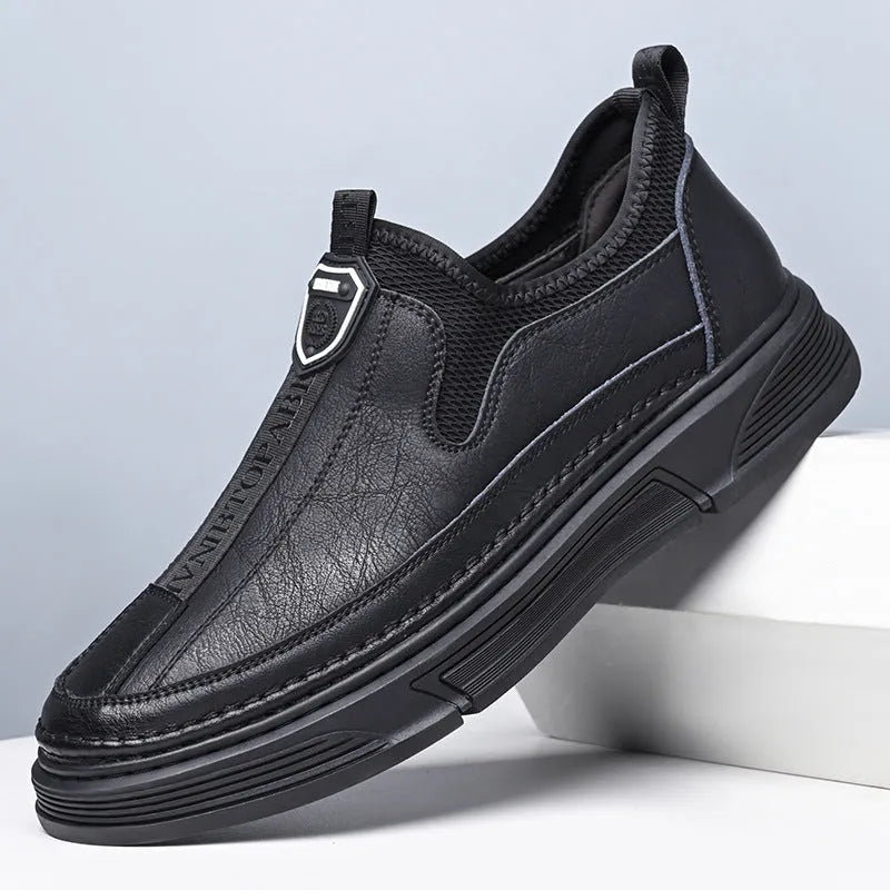 Men's black and brown solid colour leather casual shoes with round toe.