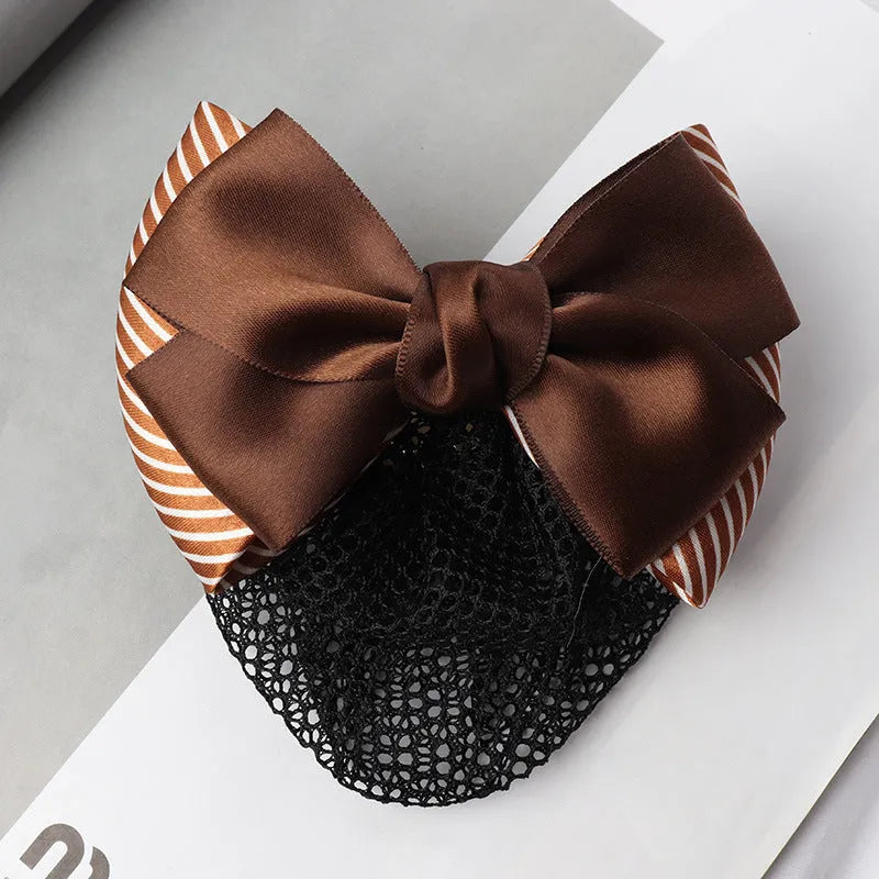 Professional flower bow headdress hair clip ornament on a work plate, shown in a selection of net and mesh colour variations.