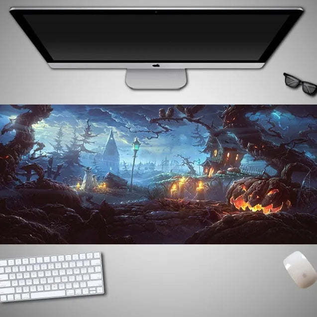 Oversized Halloween-themed computer mouse pad with non-slip rubber cloth base on a desk