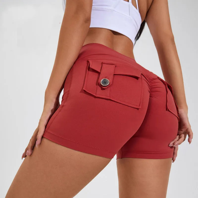 Women's high waist hip lifting fitness shorts in Electric Blue with side pockets.