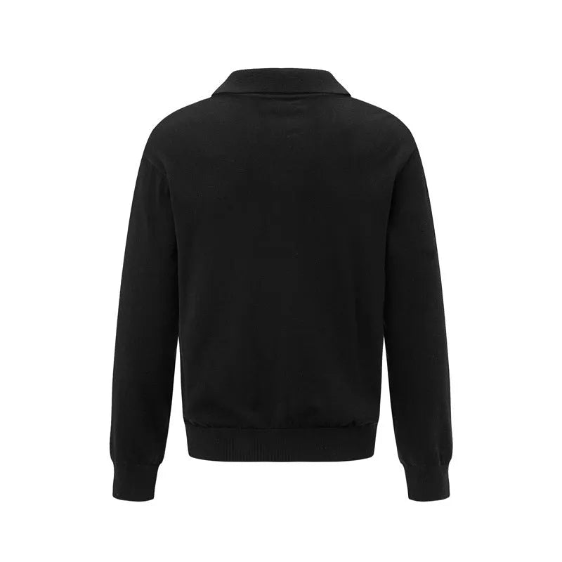 Loose black chemical fibre blend pullover shirt on hanger