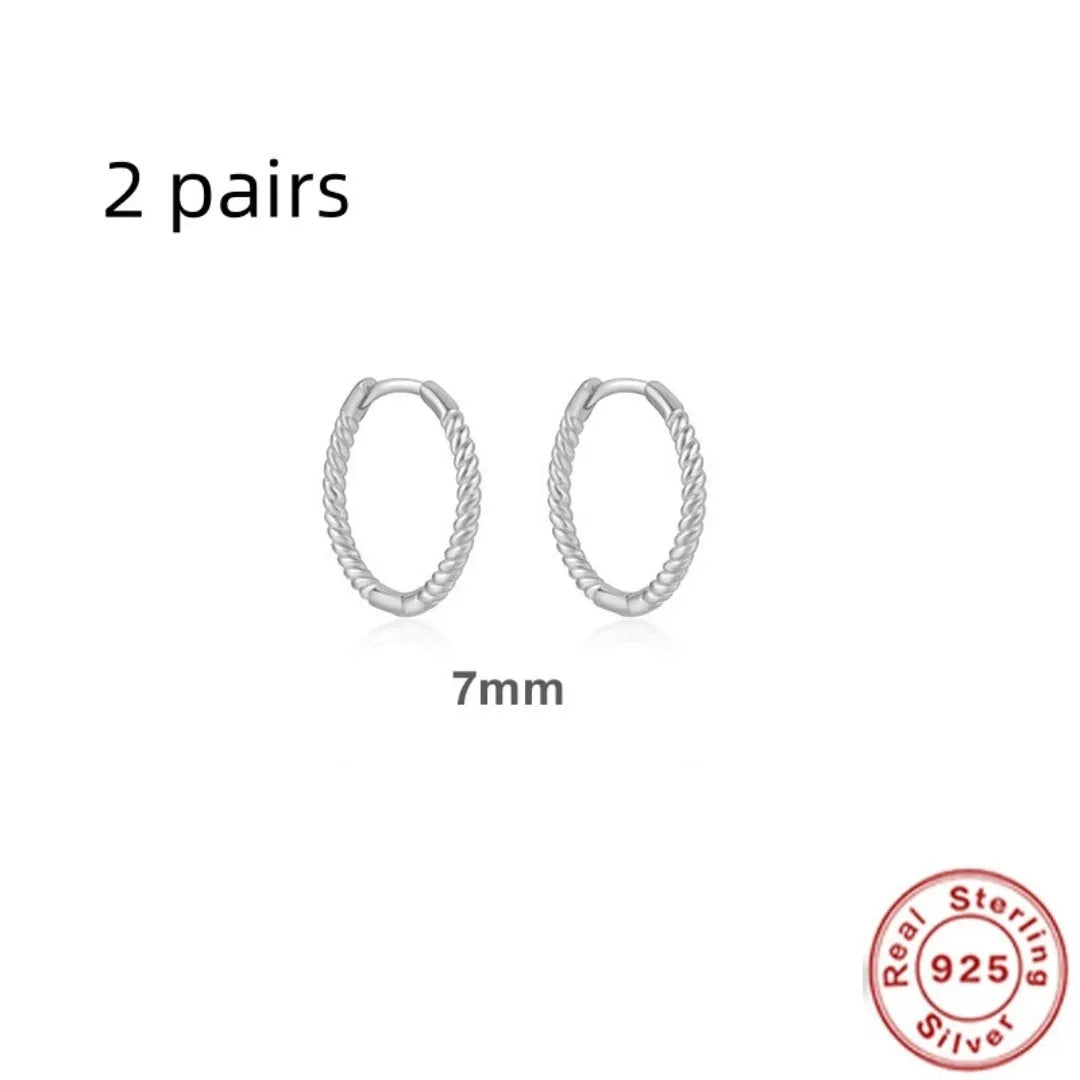 Sterling silver twisted hoop earrings with geometric round shape in gold electroplated finish