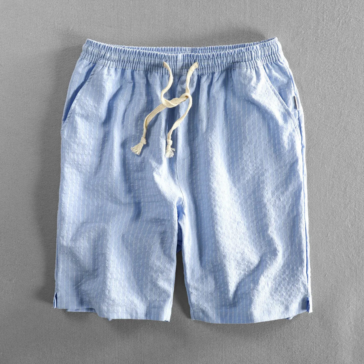 Men's striped cotton casual shorts showing straight-leg design and mid-waist fit