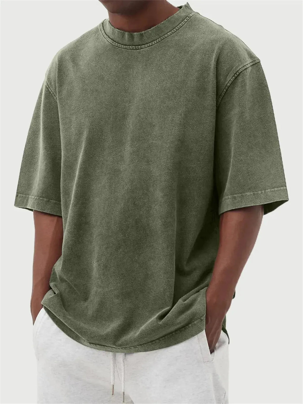 Men's loose fit distressed pullover t-shirt in stone washed polyester showing half sleeve design