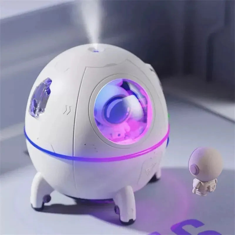 Light purple astronaut-themed USB desktop humidifier with LED lights showing compact design