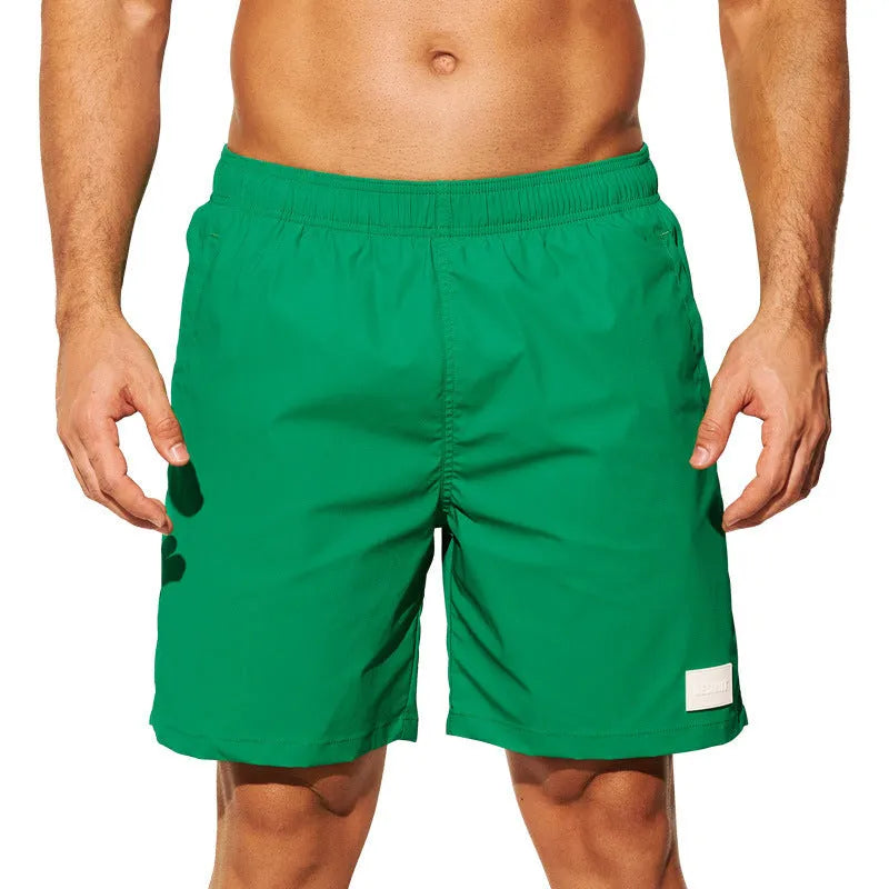Men's quick-drying nylon shorts in solid colours with straight leg opening for beach and sports