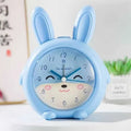 Cartoon style children's alarm clock with pink or blue colour and multiple functions