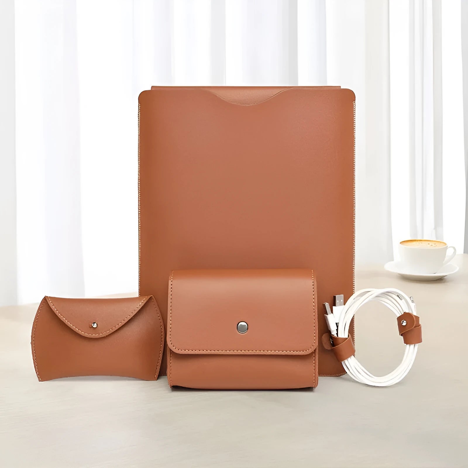 Set of four brown imitation leather lock edge protective sleeves for laptops and tablets.