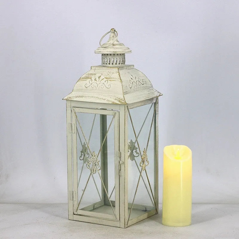 Black and white wrought iron floor-standing storm lantern with tempered glass panels for courtyard use