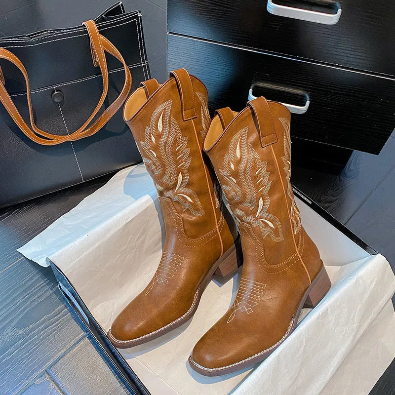 Brown women's embroidered mid-calf Martin boots with a round toe and low square heel.