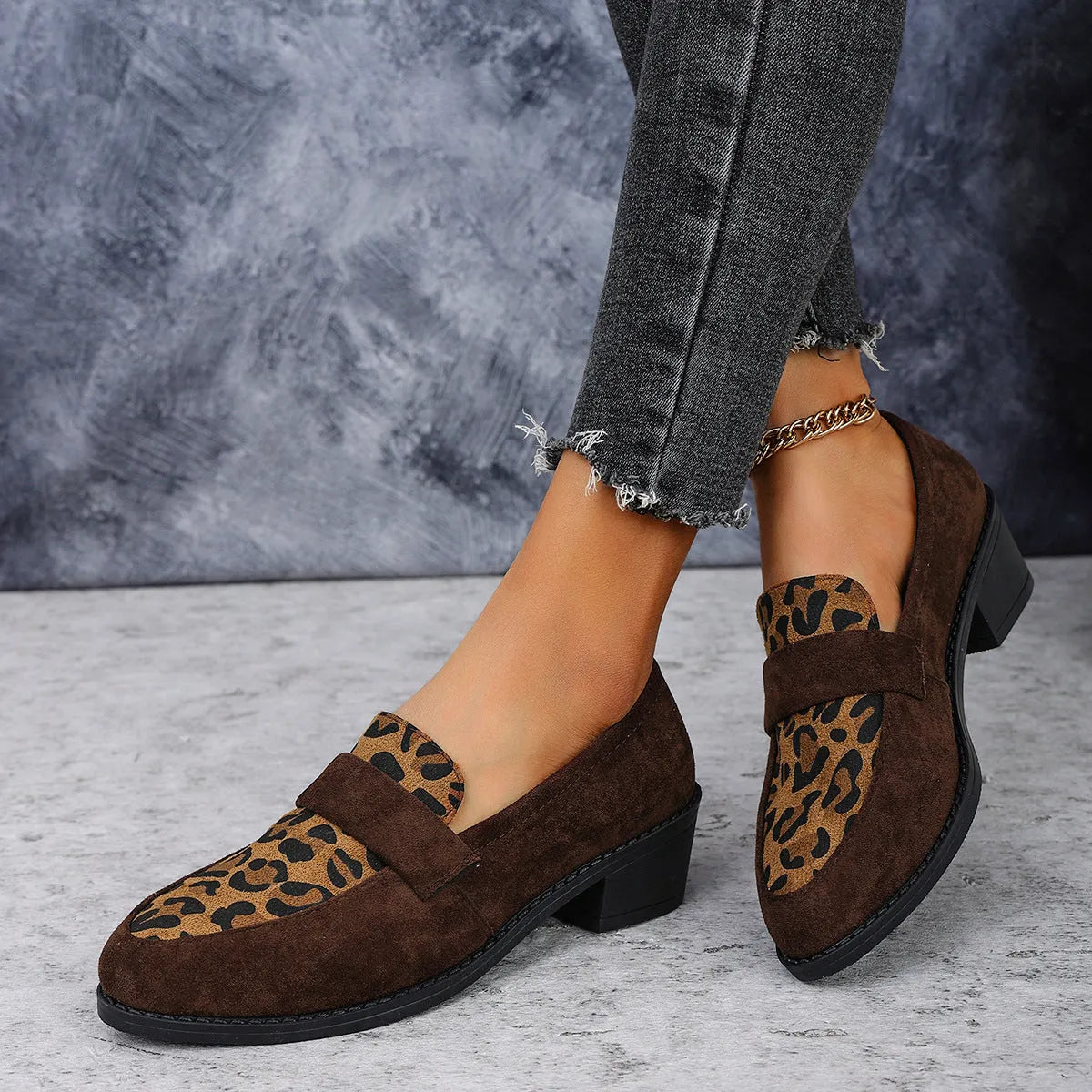 Leopard print slip-on suede shoes with chunky rubber sole and pointed toe design