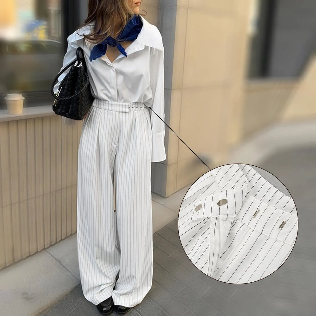 White striped wide-leg casual trousers with a front zip closure, shown in a loose fit.