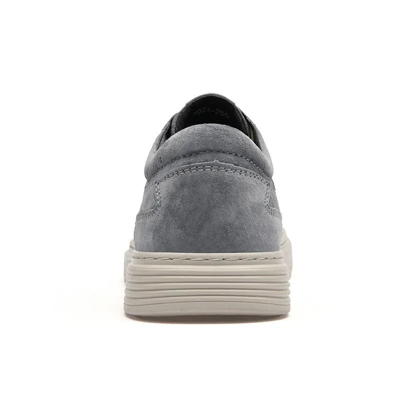 Men's grey casual skate shoes with pigskin upper and rubber sole on a white background