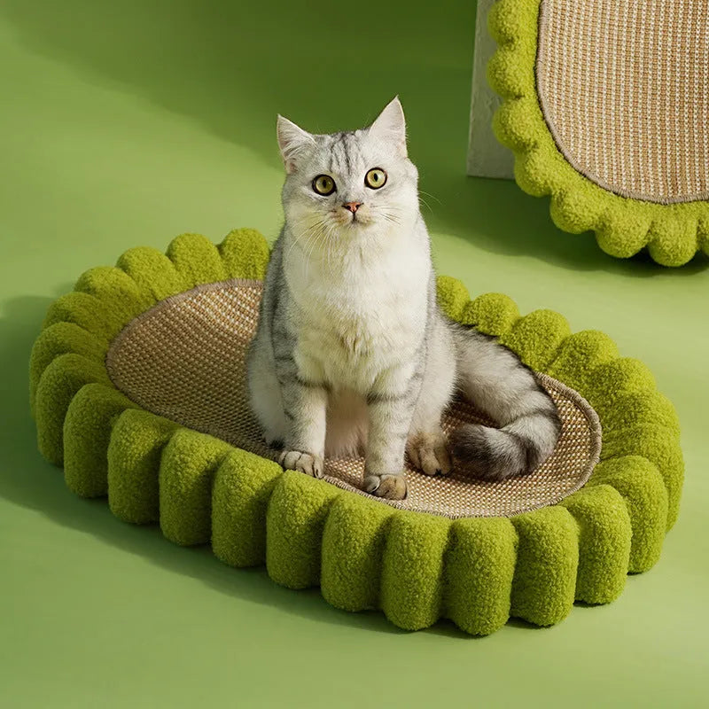 Green oval sisal cat scratcher bed measuring 650mm with scratching surface and lounging area