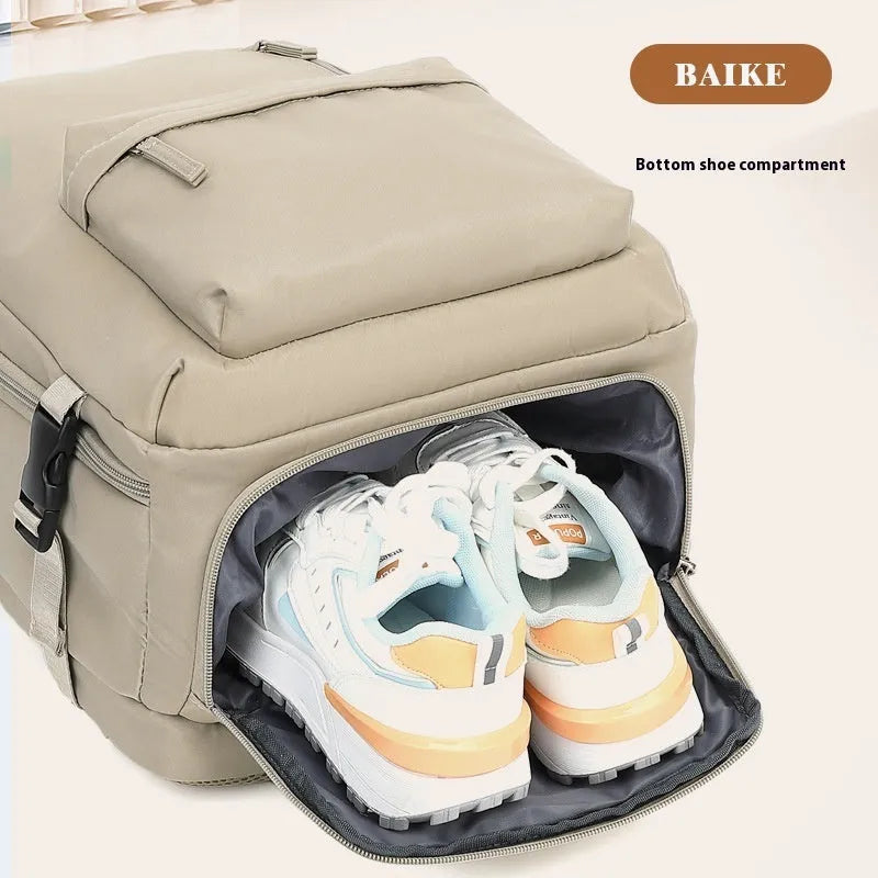 Large grey lightweight Oxford cloth travel backpack with curved shoulder straps shown from the side.