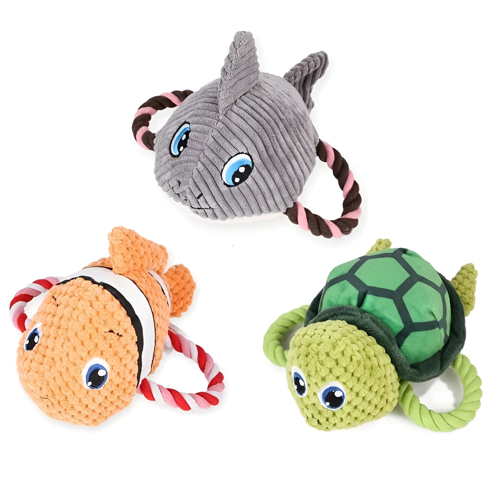 Grey, green, and orange turtle-shaped plush dog chew toy with knotted texture
