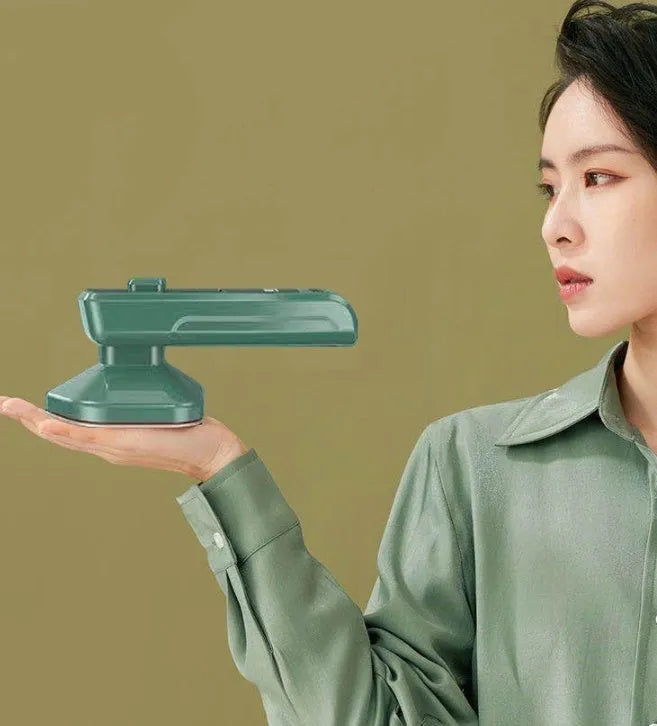 Dark green portable hanging steam iron machine with ceramic panel and compact design.