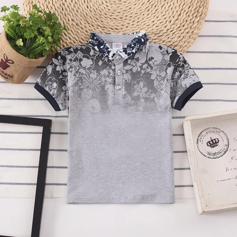 Boy in a solid colour short sleeve cotton shirt with a lapel collar.