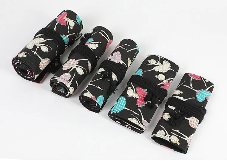 Square canvas pencil case with ballet girl print, showing multiple holes for storing sketching pencils and colour leads.