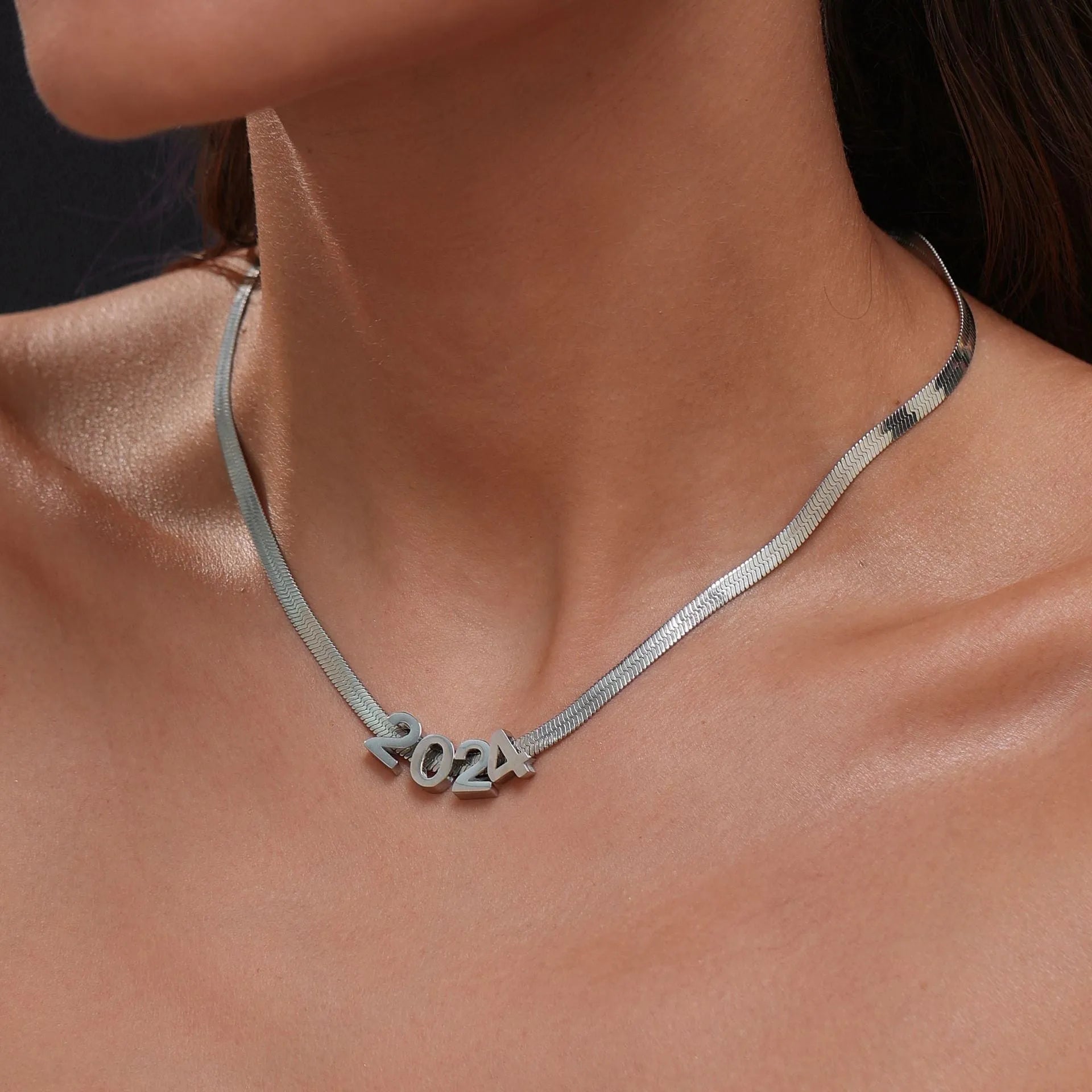 Gold titanium steel necklace with a letter A charm on a 40.5cm chain.