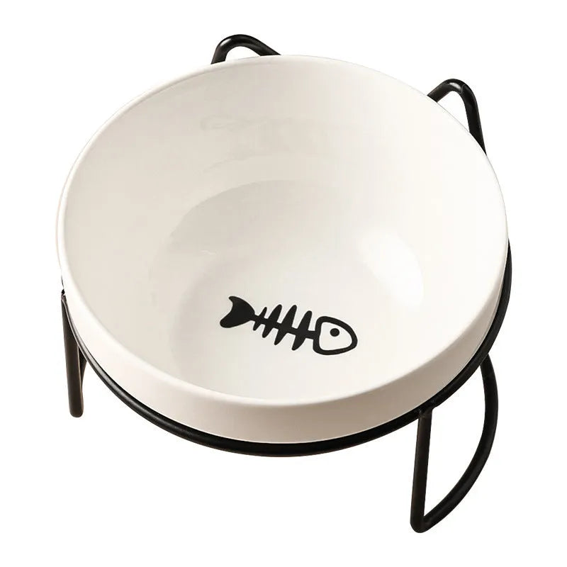White ceramic pet bowl with cat paw design on a black metal stand with cat ear details.