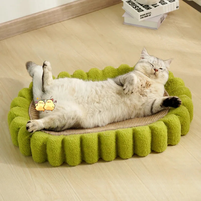 Green oval sisal cat scratcher bed measuring 650mm with scratching surface and lounging area