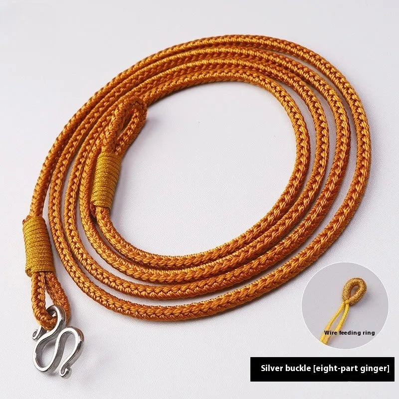 Gold peace buckle choker necklace with intricate mixed gemstone inlaid pendant on a model.