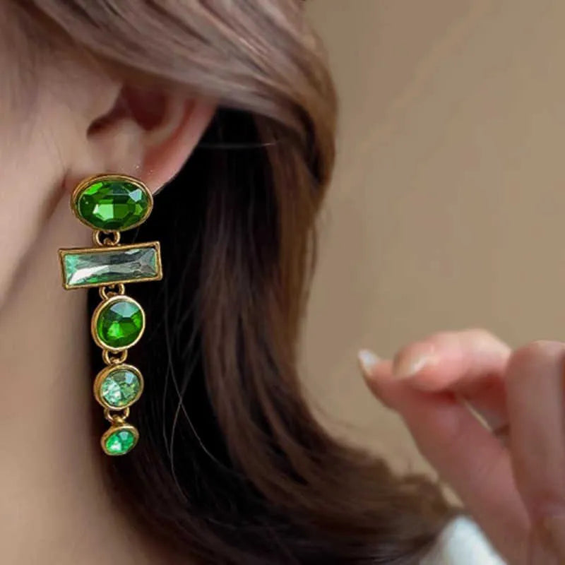 A pair of green gradient geometric alloy earrings with zircon inlay and tassel details.